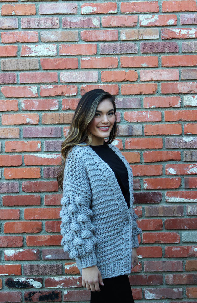 Cardigan with clearance pom pom sleeves